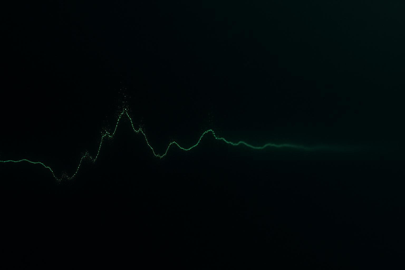 Abstract dark scene with a thin green chart line trailing across the frame, suggesting a quiet overnight session of market data